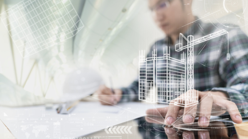 Engineer or Architech hand touching computer tablet interface with building design reality virtual technology at modern office on site. Building automation digital wireless control concept.