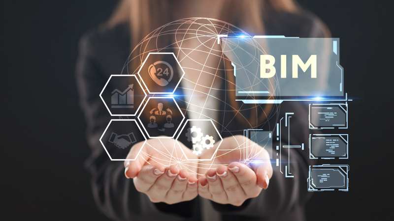 The concept of business, technology, the Internet and the network. A young entrepreneur working on a virtual screen of the future and sees the inscription: BIM